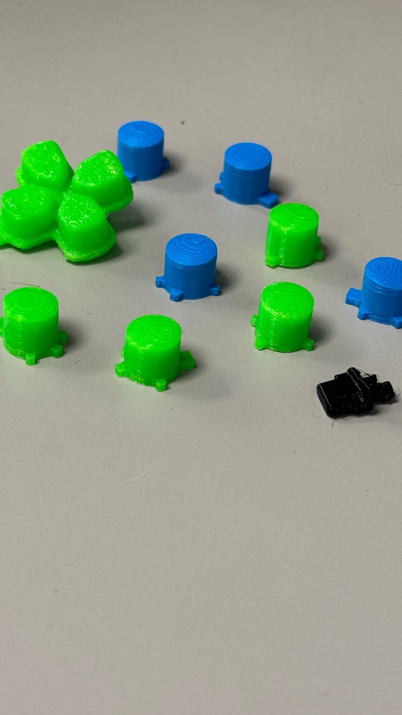 Soft Touch Playstation 5 rubberized TPU button set including Square, X, Triangle, O, Start/Share, and D-pad buttons
