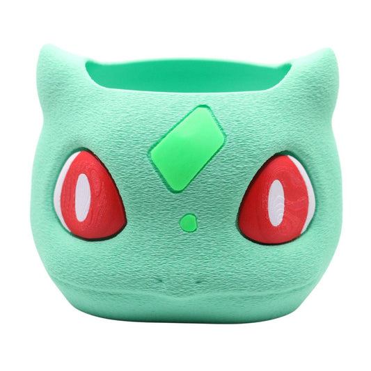 Bulbasaur Storage Bin with green textured surface and red eyes for desk or gaming room storage