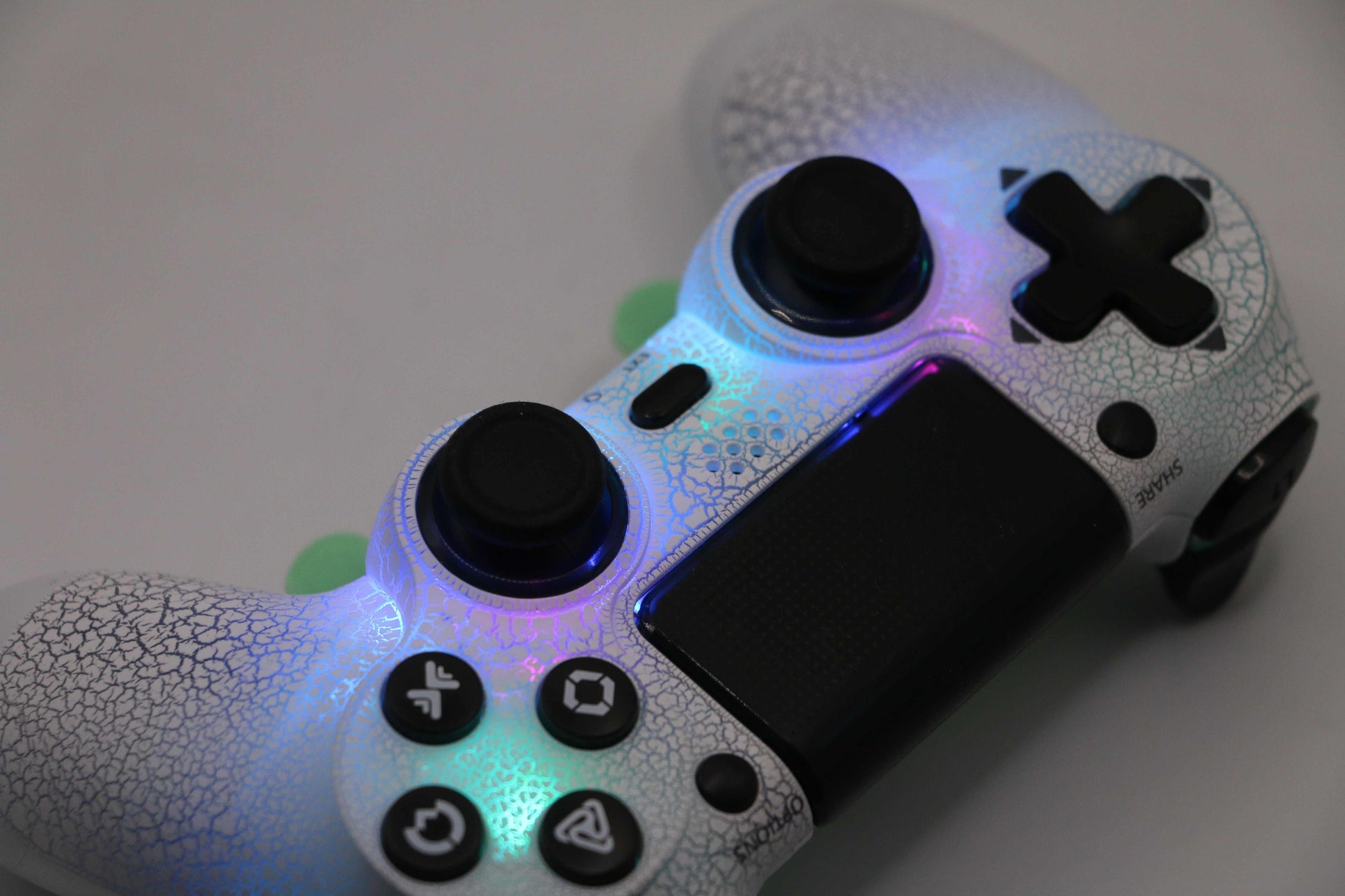 Loaded Pro LED PS4 controller with TMR thumbsticks, custom LEDs, digital hair triggers, and back paddles for FPS gaming