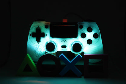 Loaded Pro LED PS4 Controller glowing blue with custom LEDs and back paddles for enhanced FPS gaming.