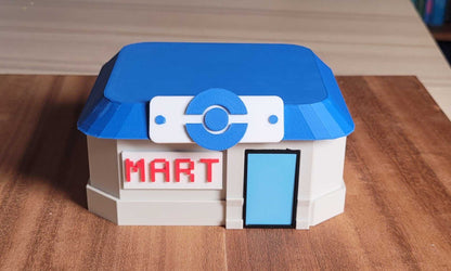 3D printed Pokemon Mart deck box with blue roof and red MART sign for card and dice storage